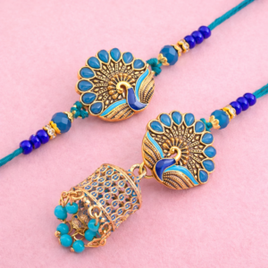 Royal peacock jhumka bhabhi rakhi with blue stones and gold detailing on pink background