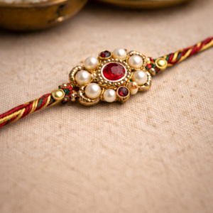Elegant red and gold pearl simple rakhi for brother – Rakhi delivery in USA