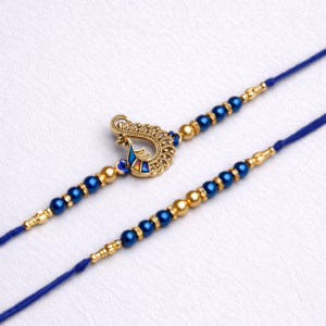 Royal blue peacock designer rakhi with gold beads and blue thread on white background