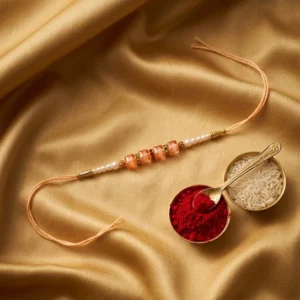 Pearl-Rakhi -with-Gold-Single
